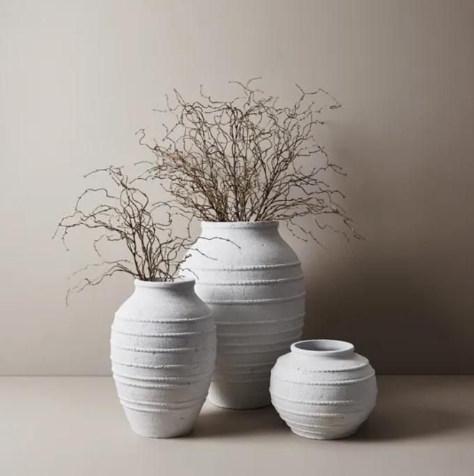 Large and small white outdoor pots